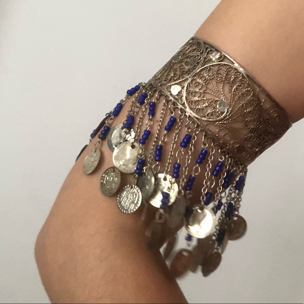 Metal bracelet with pendants.
